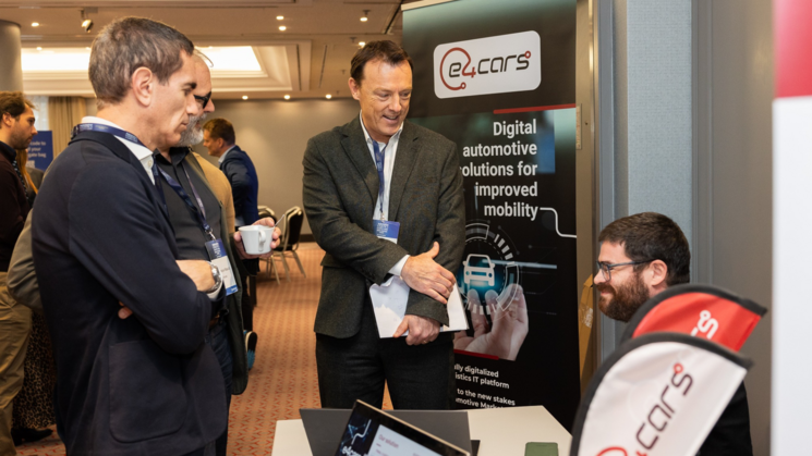 ALSC Digital Strategies Europe 2024 partners at exhibition booth interacting with attendees.